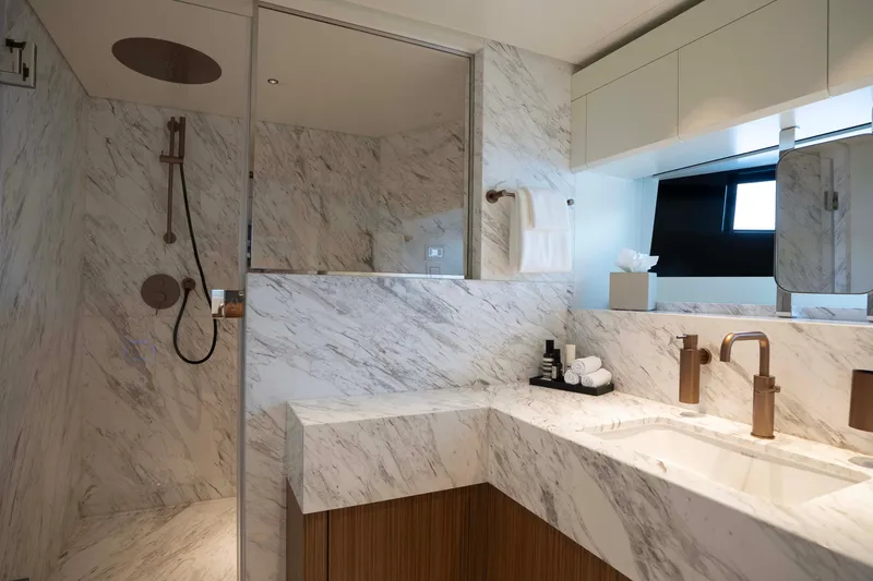 Slide: The Image of Luxurious marble bathroom in 2025 Alpha 100 Squalo Co Ownership yacht, featuring modern fixtures. - 34