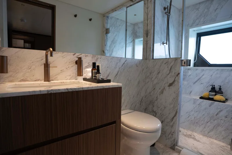 Slide: The Image of Luxurious bathroom in 2025 Alpha 100 Squalo Co Ownership yacht, featuring marble and modern fixtures. - 35