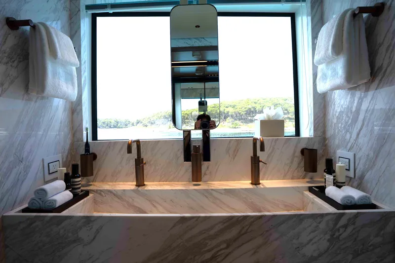Slide: The Image of Luxurious marble bathroom with dual sinks in 2025 Alpha 100 Squalo Co Ownership. - 36