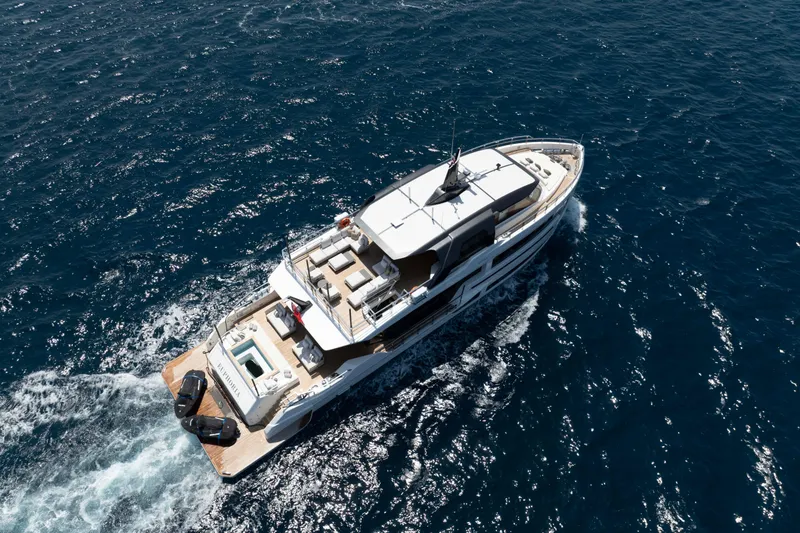 Slide: The Image of Luxury yacht "Alpha 100 Squalo Co Ownership" cruising on open sea, 2025 model. - 4