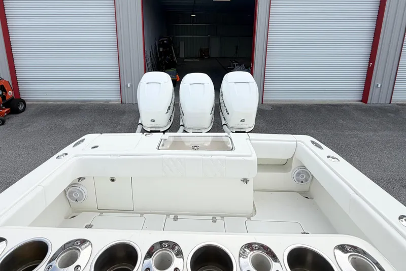 Slide: The Image of 2017 SeaVee 340Z boat with triple outboard engines in storage facility. - 8