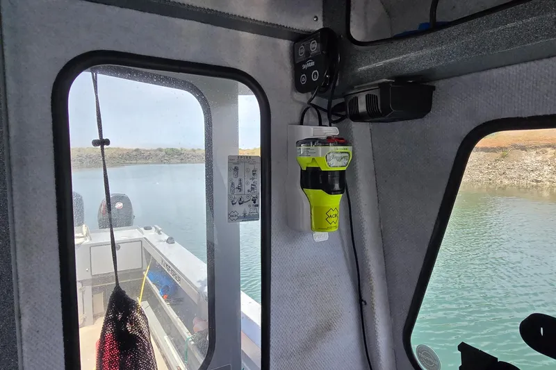Slide: The Image of Interior view of a 2021 KingFisher 2825 Coastal Express boat with safety equipment. - 10
