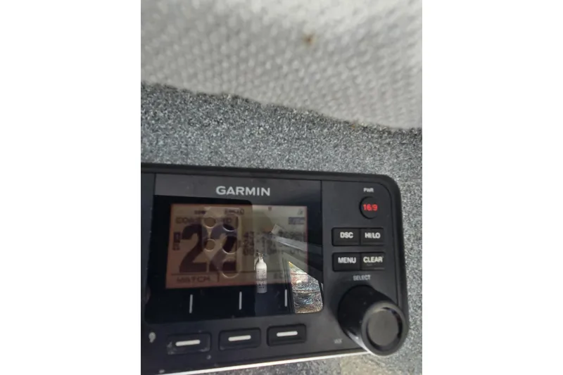 Slide: The Image of Garmin marine radio display on 2021 KingFisher 2825 Coastal Express boat. - 16