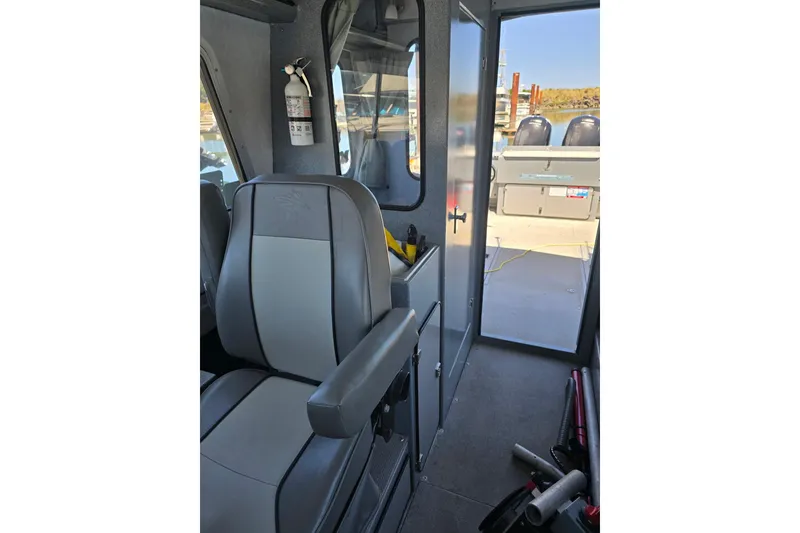 Slide: The Image of Interior of 2021 KingFisher 2825 Coastal Express boat, featuring seating and equipment. - 4