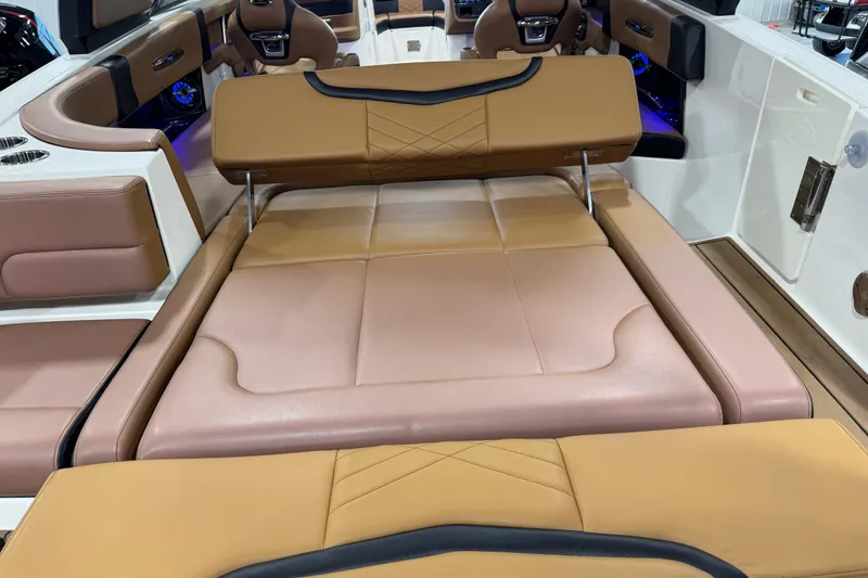 Slide: The Image of 2021 Chaparral 287 SSX boat interior with luxurious tan leather seating and modern design. - 13