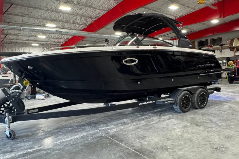 Slide: The Image of 2021 Chaparral 287 SSX boat on trailer in indoor showroom. - 2