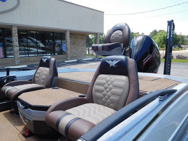 Slide: The Image of 2026 Vexus VXs21 boat with luxurious seats and Mercury Pro XS engine. - 12
