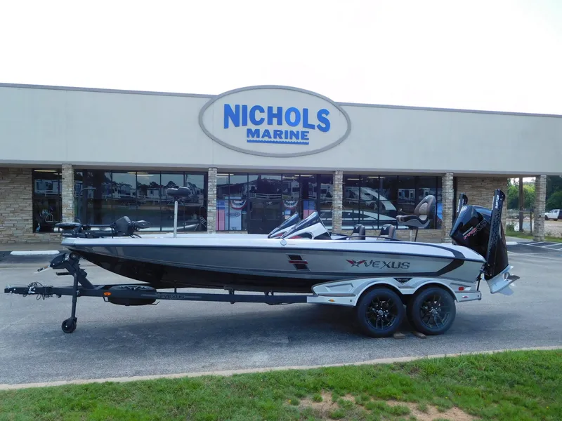 Slide: The Image of 2026 Vexus VXs21 boat in front of Nichols Marine store. - 2