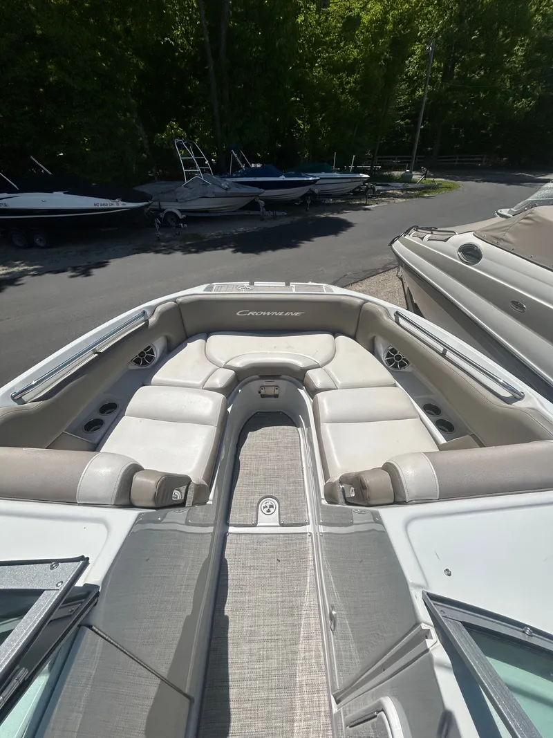 Slide: The Image of Interior view of a 2019 Crownline E255XS boat with seating area. - 19