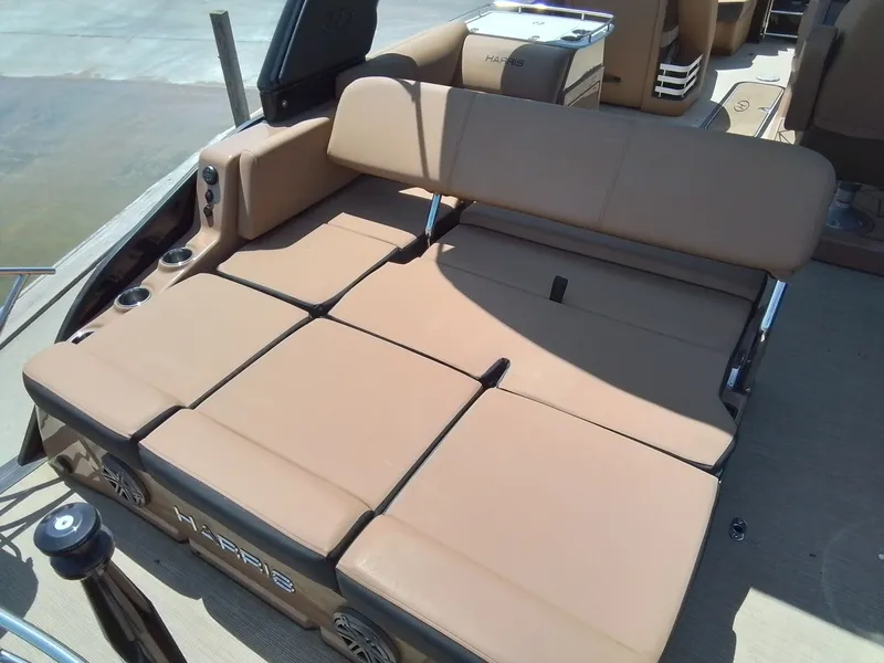 Slide: The Image of 2023 Harris 230 Grand Marin boat with beige lounge seating. - 20