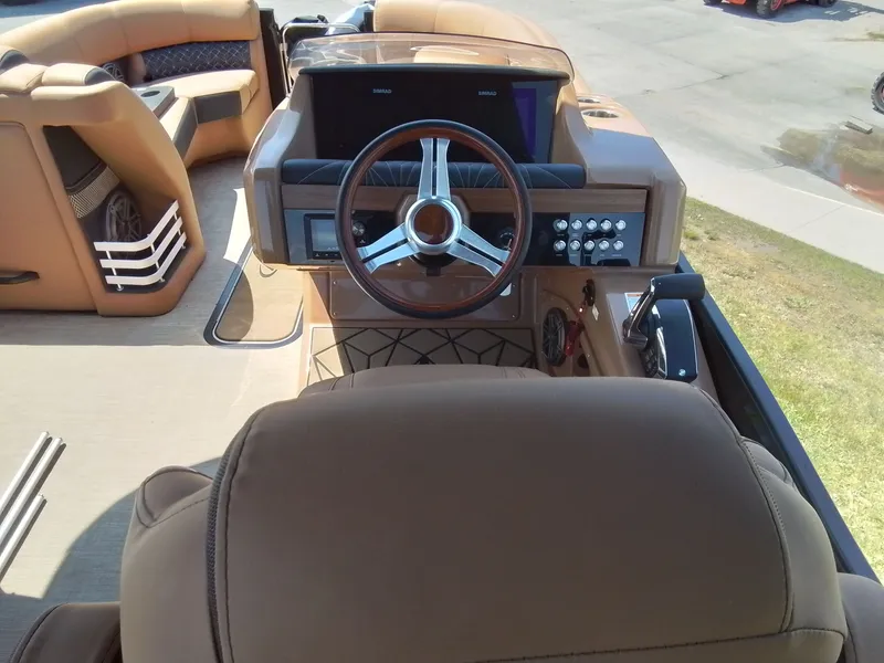 Slide: The Image of Interior of 2023 Harris 230 GRAND MARIN with steering wheel and control console. - 21
