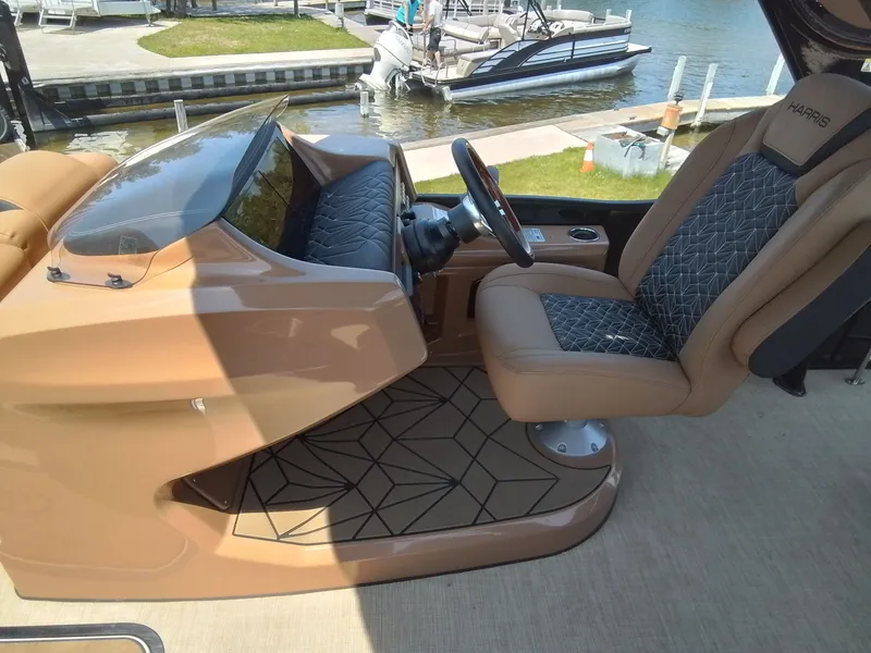 Slide: The Image of Interior of a 2023 Harris 230 GRAND MARIN boat by the water. - 23