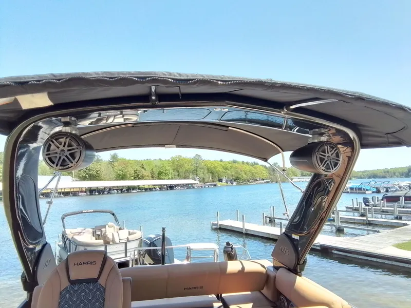 Slide: The Image of Harris 230 GRAND MARIN 2023 on a sunny lake with dock. - 24