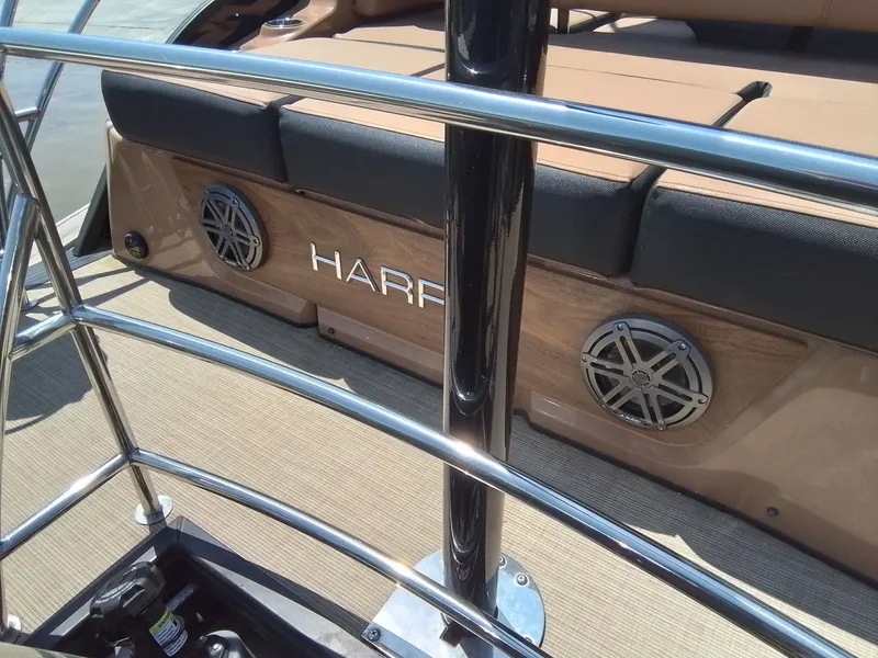 Slide: The Image of 2023 Harris 230 GRAND MARIN boat with speakers and seating area. - 29