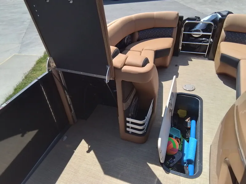Slide: The Image of Interior of 2023 Harris 230 GRAND MARIN with storage and seating area. - 30