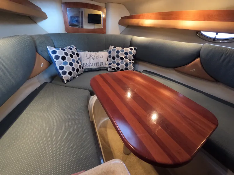 Slide: The Image of Interior of 2006 Four Winns 278 Vista with cozy seating area. - 13