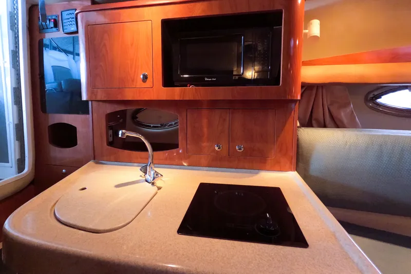 Slide: The Image of Interior of 2006 Four Winns 278 Vista with kitchenette. - 14