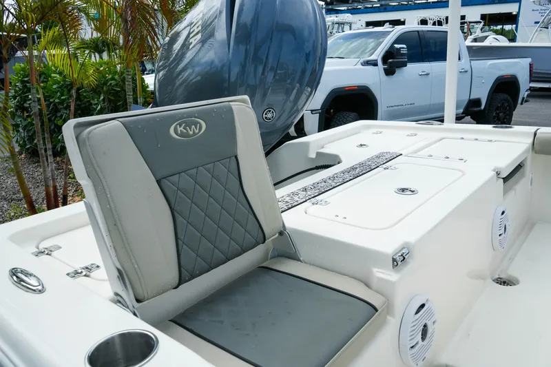 Slide: The Image of 2025 Key West 210 Bay Reef boat interior with seating and Yamaha engine. - 17