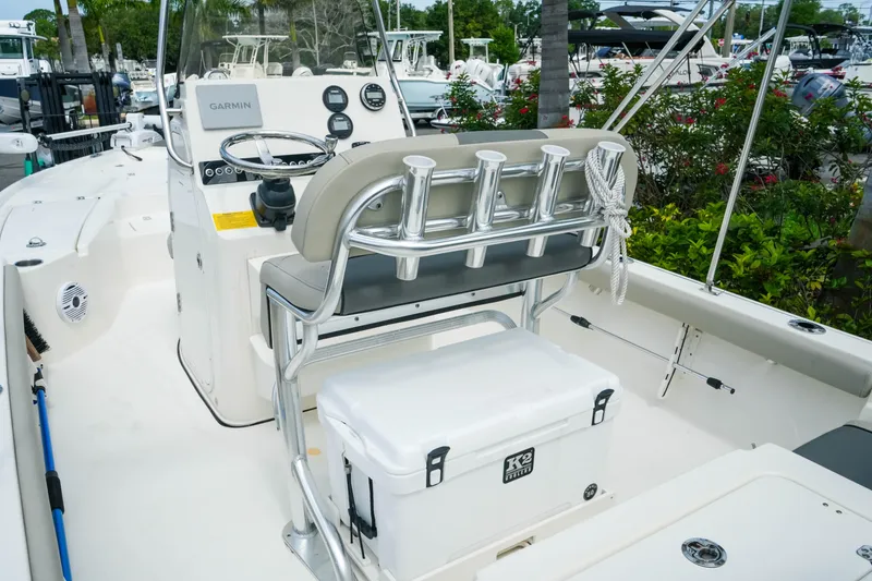 Slide: The Image of 2025 Key West 210 Bay Reef boat interior with steering console and seating. - 21