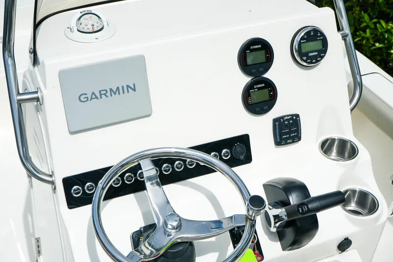 Slide: The Image of 2025 Key West 210 Bay Reef boat dashboard with Garmin navigation system. - 24