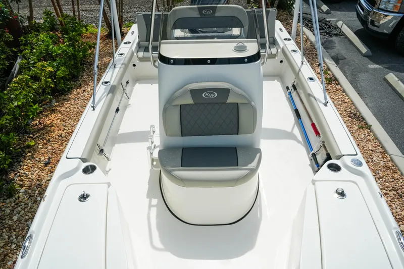 Slide: The Image of 2025 Key West 210 Bay Reef boat interior with seating and console. - 30