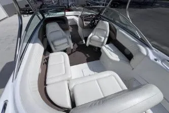 Slide: The Image of Interior of a 2007 Cobalt 232 boat with white seating and steering console. - 12