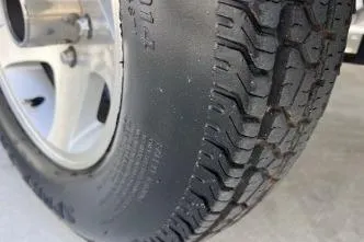 Slide: The Image of Close-up of a 2007 Cobalt 232 tire with detailed tread pattern. - 25
