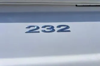 Slide: The Image of 2007 Cobalt 232 boat model emblem on white surface. - 27