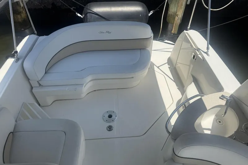 Slide: The Image of 2008 Sea Ray Sundancer 260 boat interior with white seating and compact sink area. - 27