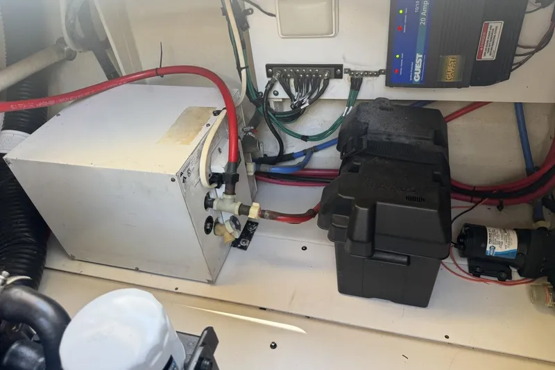 Slide: The Image of Engine compartment of a 2008 Sea Ray Sundancer 260 with electrical components and wiring. - 46