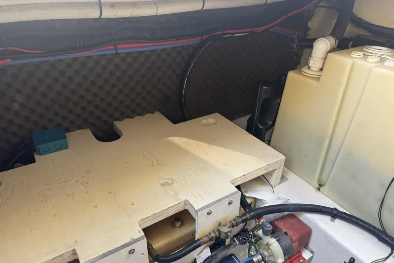 Slide: The Image of Engine compartment of a 2008 Sea Ray Sundancer 260 boat, showing components and wiring. - 44
