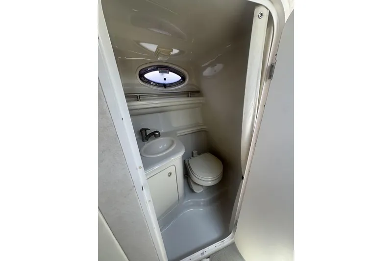 Slide: The Image of Compact bathroom in 2008 Sea Ray Sundancer 260 boat with sink and toilet. - 33