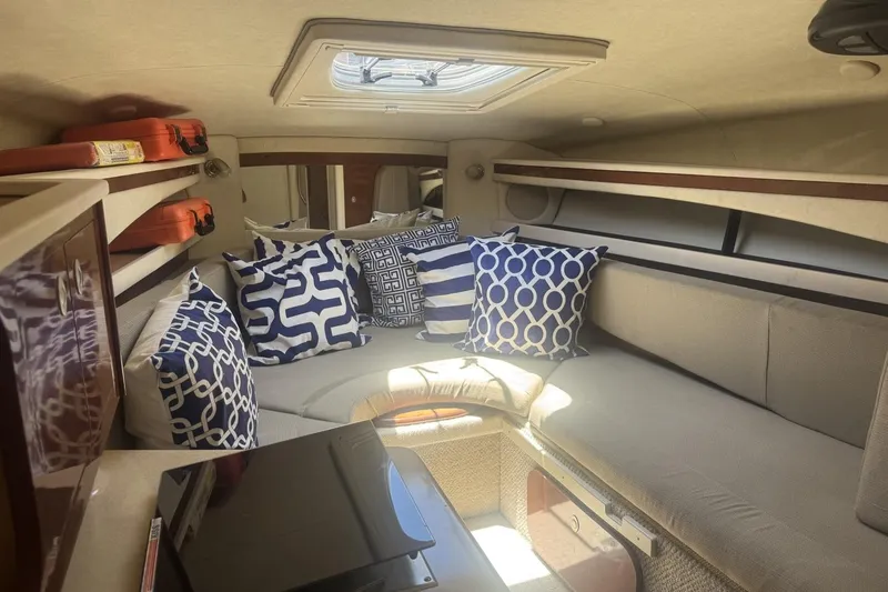 Slide: The Image of Interior of 2008 Sea Ray Sundancer 260 with patterned cushions and cozy seating area. - 30