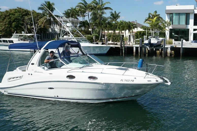Slide: The Image of 2008 Sea Ray Sundancer 260 cruising in a sunny waterfront setting. - 3