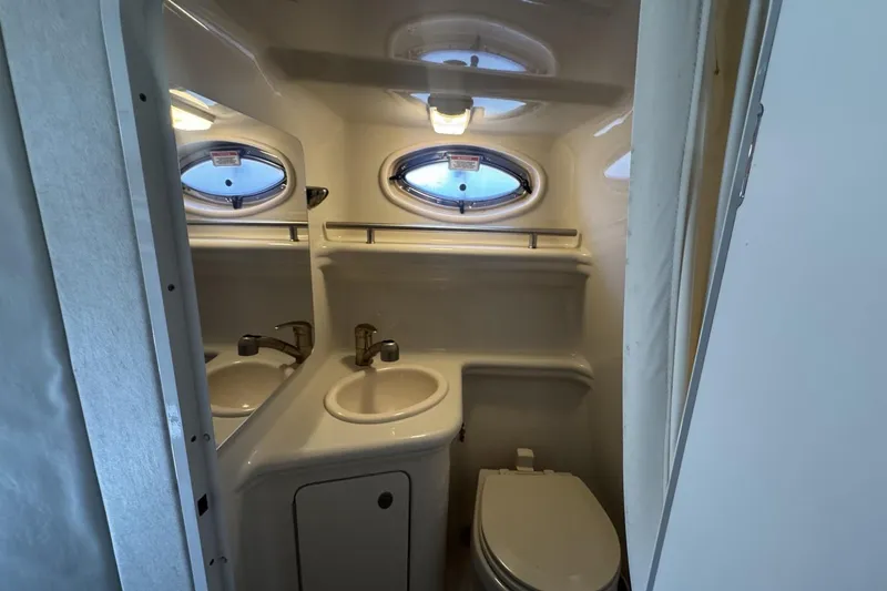 Slide: The Image of Compact bathroom in 2008 Sea Ray Sundancer 260 boat with sink and toilet. - 40