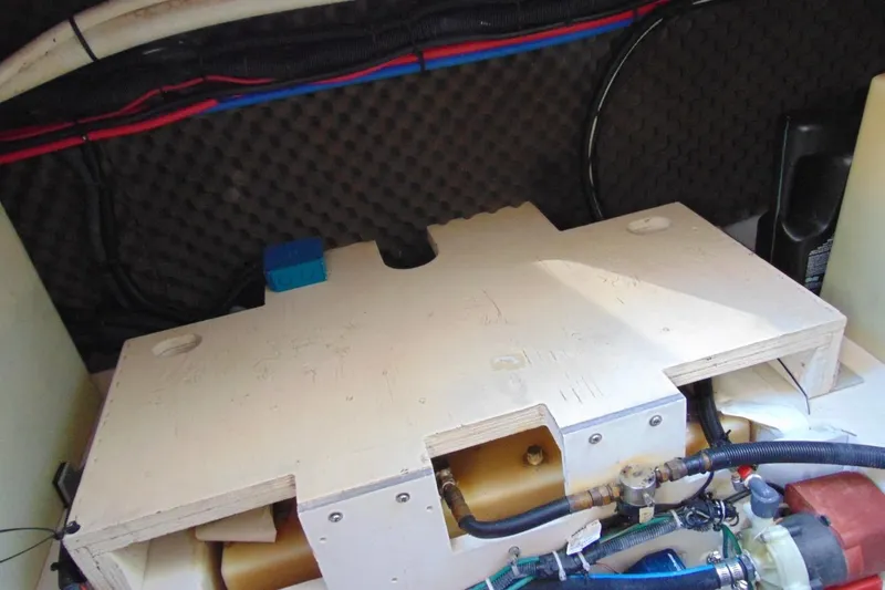 Slide: The Image of Engine compartment of a 2008 Sea Ray Sundancer 260 boat, showcasing wiring and components. - 16
