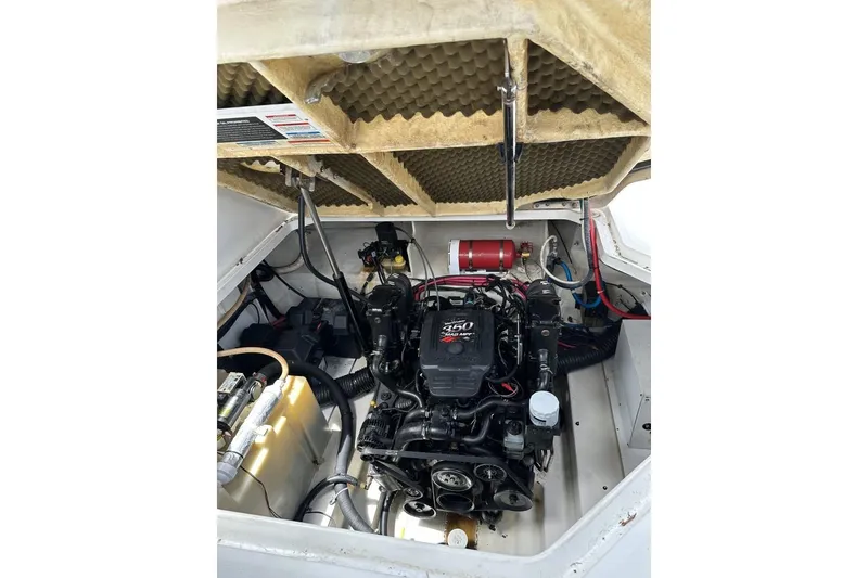 Slide: The Image of Engine compartment of a 2008 Sea Ray Sundancer 260 boat, showcasing the engine and components. - 19