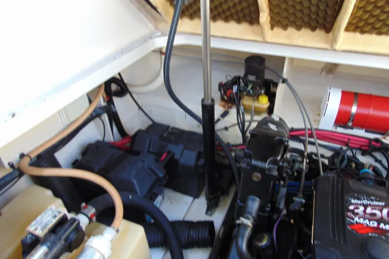 Slide: The Image of Engine compartment of a 2008 Sea Ray Sundancer 260 with MerCruiser 350 engine components. - 12