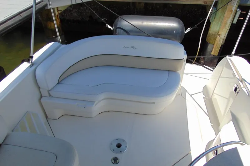 Slide: The Image of 2008 Sea Ray Sundancer 260 boat interior with white seating and sleek design. - 9