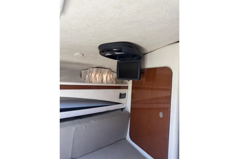 Slide: The Image of Interior of 2008 Sea Ray Sundancer 260 with TV and cozy seating area. - 41
