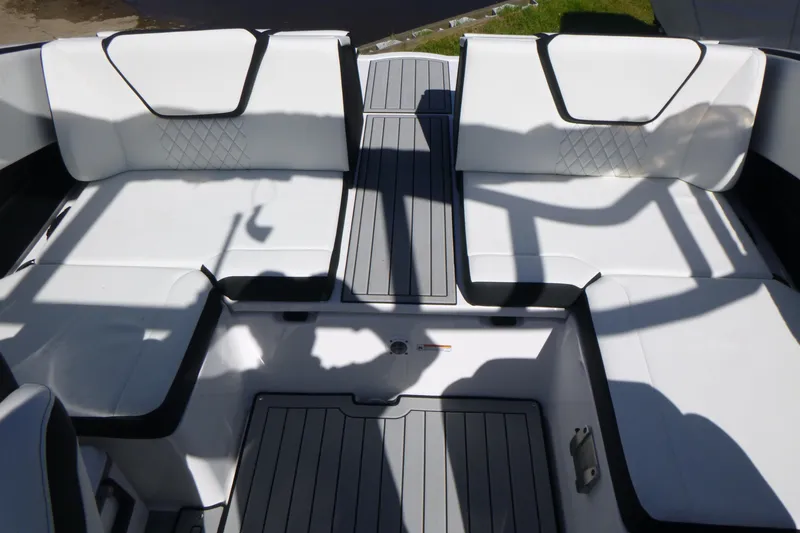 Slide: The Image of 2026 Yamaha Boats 222SD interior with white cushioned seating and sleek design. - 14