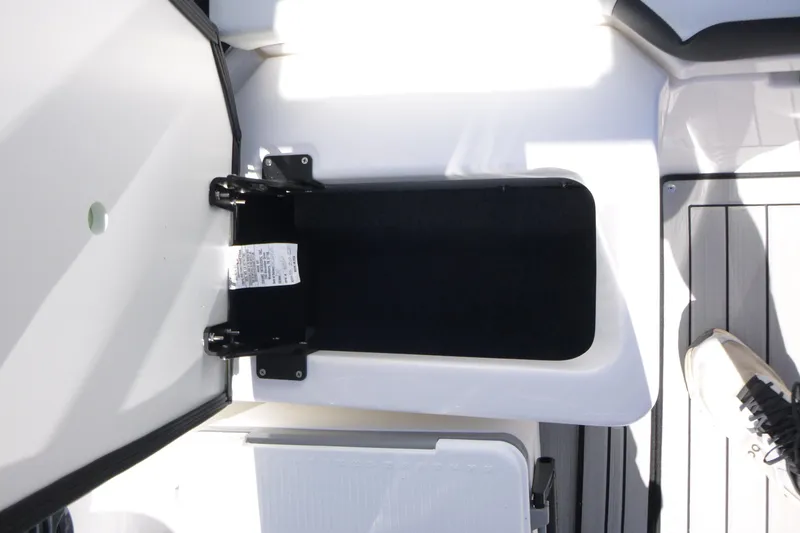 Slide: The Image of Open storage compartment on 2026 Yamaha Boats 222SD, featuring sleek design and modern materials. - 16