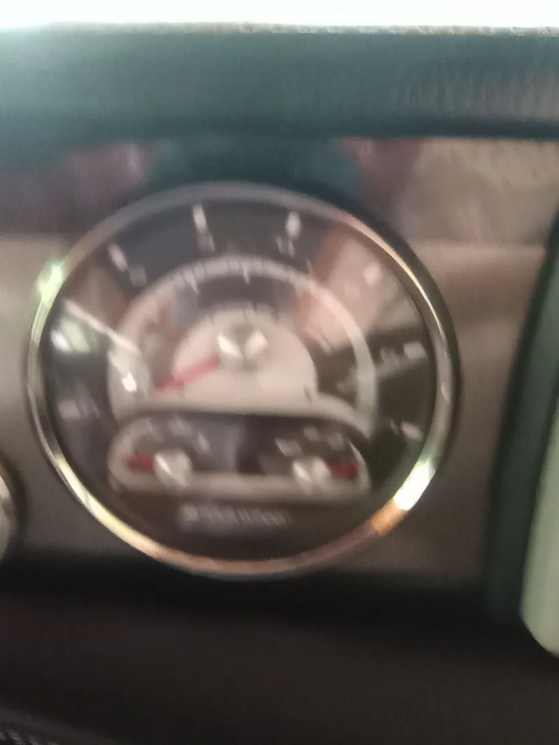 Slide: The Image of Tachometer of a 2013 Four Winns H260 boat. - 14