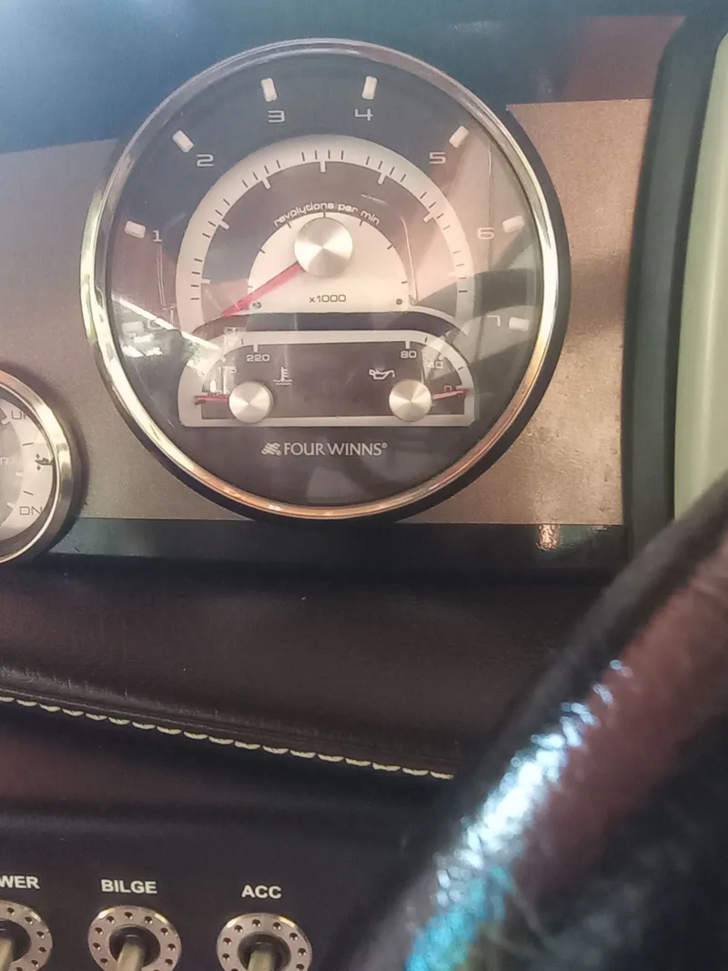 Slide: The Image of Tachometer of a 2013 Four Winns H260 boat, displaying RPM. - 15