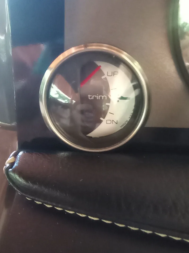 Slide: The Image of Trim gauge of a 2013 Four Winns H260 boat. - 16