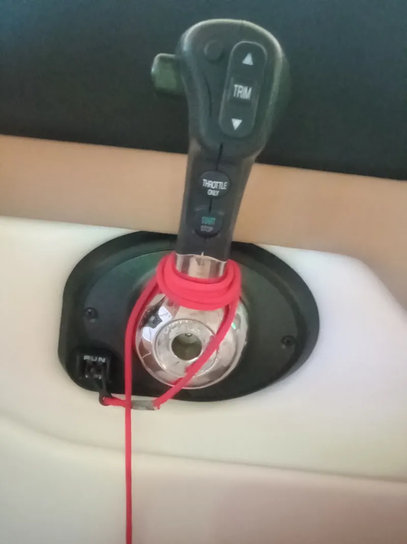 Slide: The Image of 2013 Four Winns H260 boat control with red safety cord. - 17