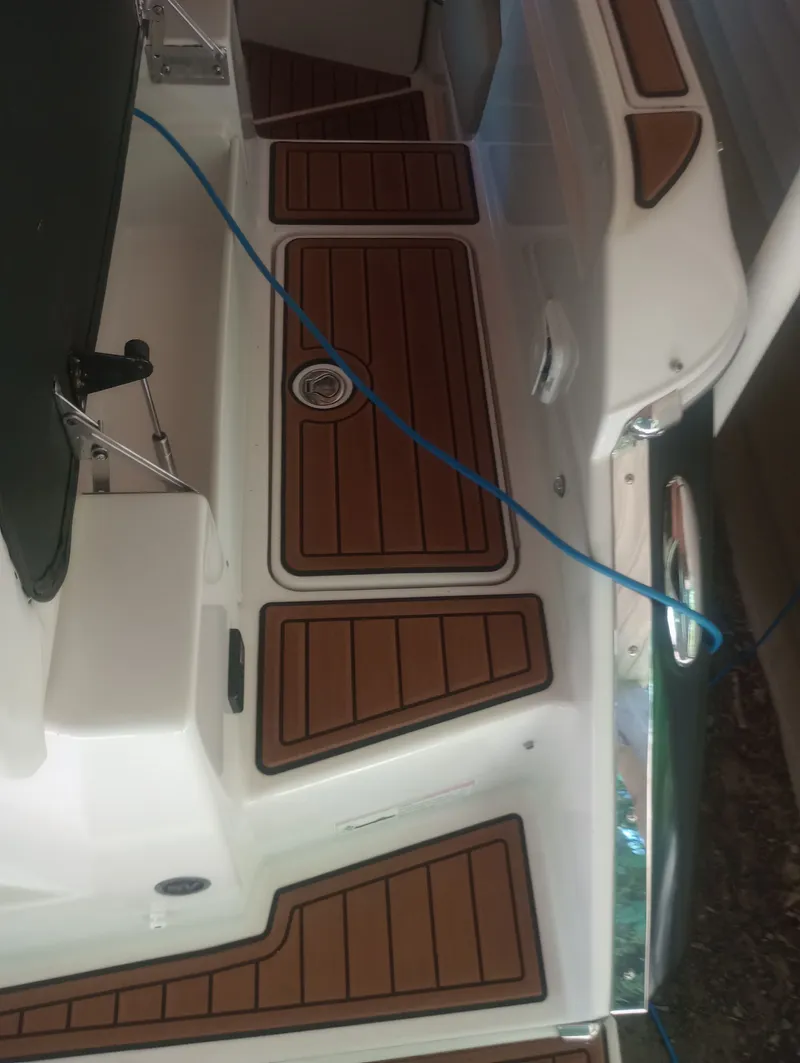 Slide: The Image of 2013 Four Winns H260 boat with wood-look deck. - 23