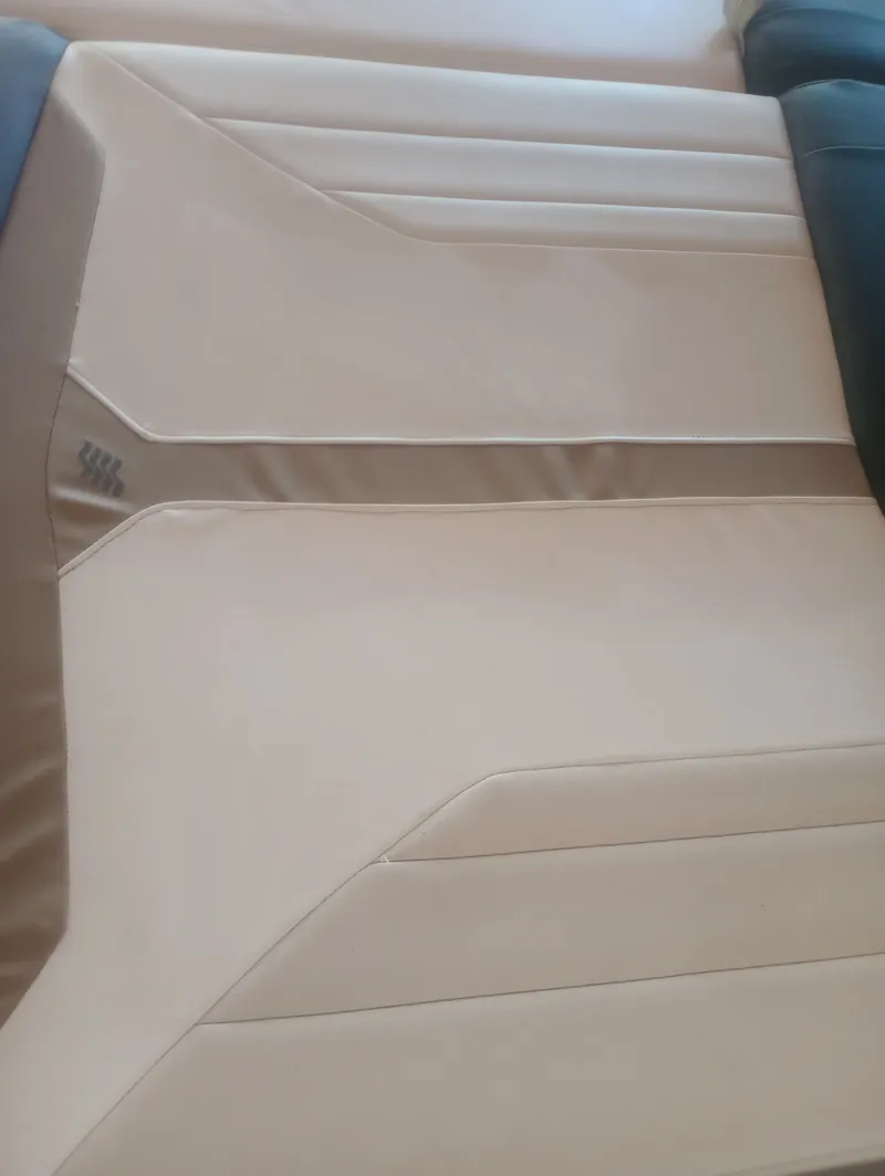 Slide: The Image of Beige seat upholstery of a 2013 Four Winns H260 boat. - 24