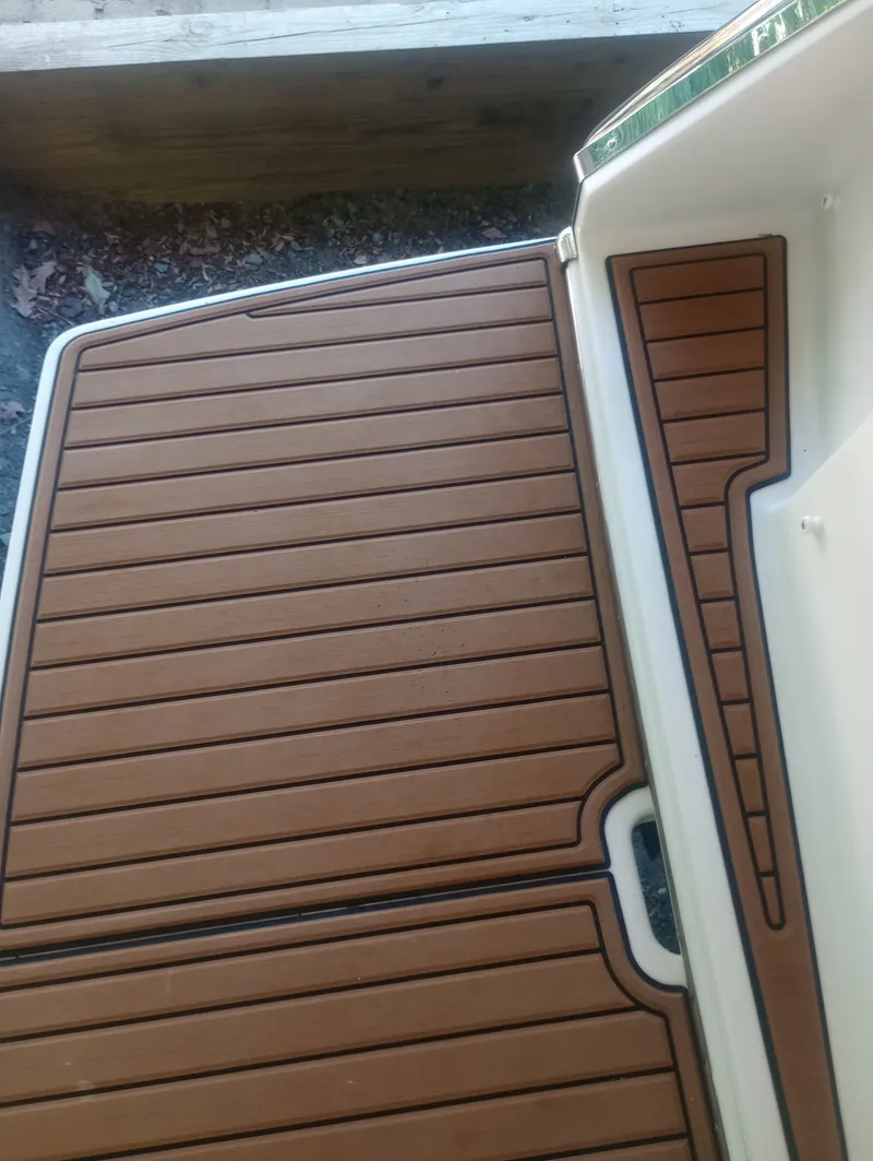 Slide: The Image of Teak deck of a 2013 Four Winns H260 boat. - 25
