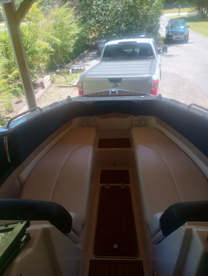 Slide: The Image of Interior view of a 2013 Four Winns H260 boat on a trailer. - 28